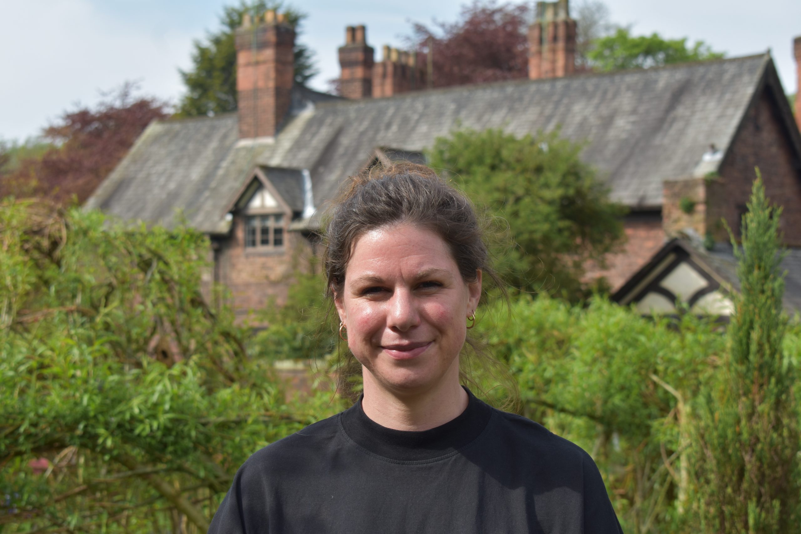 Portrait of Sarah Ducker against backdrop of Wardley Hall